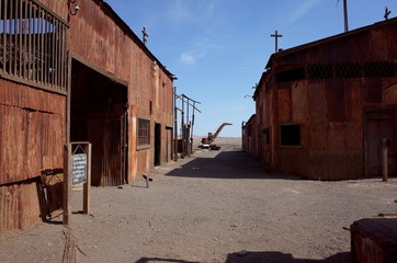 An eerie street in the abandoned Humberstone saltpeter works. This abandoned nitrate town was...