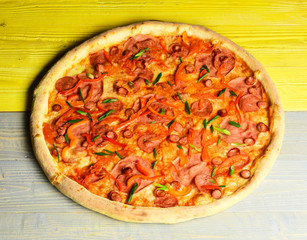 Take away food with red sauce and crunchy edges.