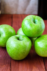 Simbirenko's green apples on a wooden table