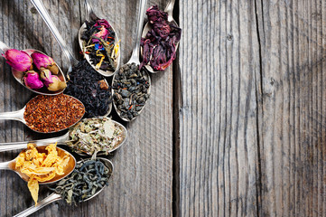 The different kinds of tea presented as a sample in the silver spoons, top view