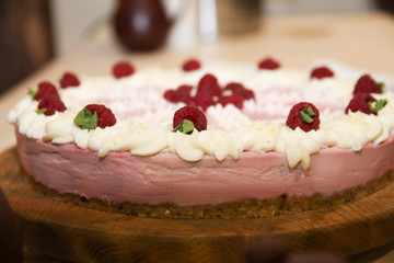  Homemade cake decorated berries on plate over wooden turquoise background