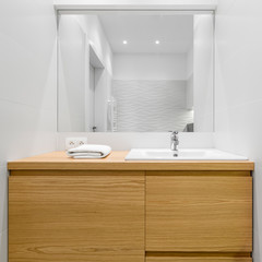 Big wooden drawers in bathroom