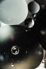 water and oil, beautiful color abstract background based on white and gray circles and ovals, macro abstraction