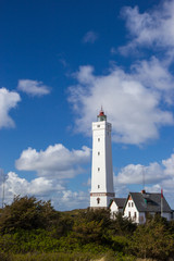 Fototapeta na wymiar Lighthouse in Blaavand beach, southern Denmark
