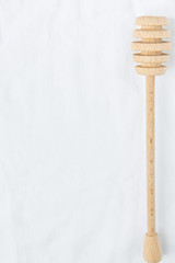 Wooden Honey Dipper Spoon on White Linen Fabric Background Table. Holiday Baking Cooking Workshop Course Announcement Template. Christmas Easter. Styled Image for Social Media Blogging Recipe
