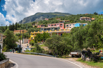 Fototapeta na wymiar Colorful houses in mountain village on Corfu island, Greece