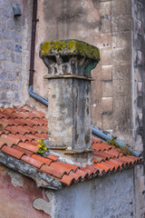 Close up on a tiled roof with chimnej on historical Old Town of Kotor in Montenegro
