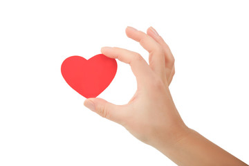 Obraz na płótnie Canvas hand holding small bright red heart on white background