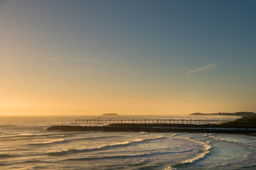 Obraz premium Gold Coast, Queensland/Australia - 19 January 2018: Morning views from Point Danger over the rock wall and sand pumping jetty on the Southern Gold Coast, Australia.