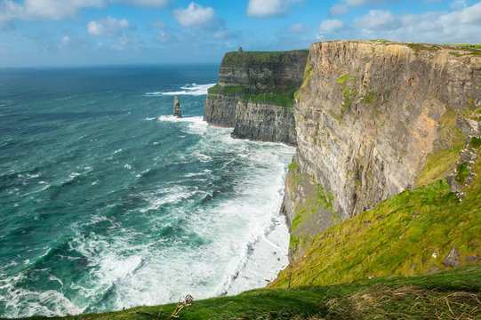 The Cliffs of Moher, Irelands Most Visited Natural Tourist Attraction, are sea cliffs located at the southwestern edge of the Burren region in County Clare, Ireland. © drimafilm