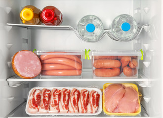 Refrigerator with fresh meat products, closeup