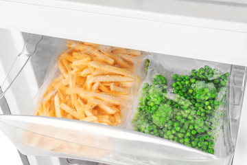 Frozen vegetables in refrigerator, closeup © Africa Studio