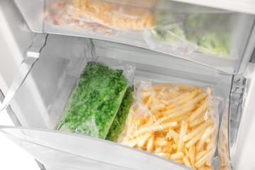 Frozen vegetables in refrigerator, closeup © Africa Studio
