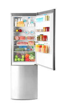Refrigerator with fresh products on white background