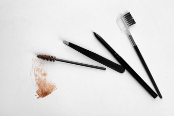 Tools for eyebrow dyeing and correction on light background