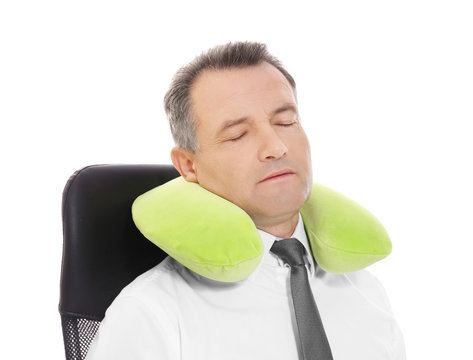 Mature Businessman With Travel Pillow On White Background