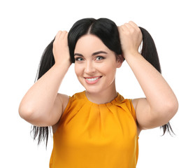 Fototapeta premium Portrait of young smiling woman on white background