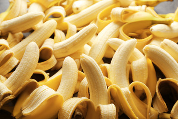 Peeled ripe bananas on table