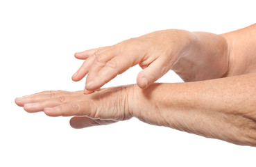 Hands of senior woman with healthy skin softened by cream with moisturizing effect, on white background