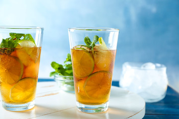 Glasses with Cuba Libre cocktail on wooden board