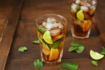 Glasses with Cuba Libre cocktail on wooden table