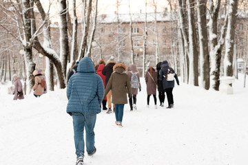 Children walk in winter Park.