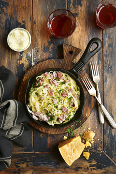 Traditional italian dish spaghetti carbonara with bacon in a cream sauce.Top view with copy space.