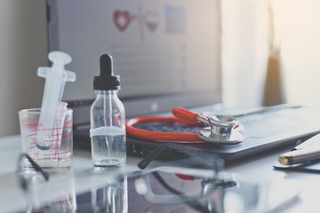 Close up of red stethoscope on desk,Healthcare and medical concept