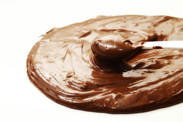 Melted chocolate as background /  By melting chocolate, you create a tool for dipping, topping, and decorating with chocolate