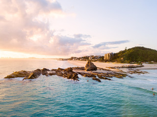 Currumbin Beach also known as Currumbin Alley at sunrise on the Gold Coast in Queensland in Australia