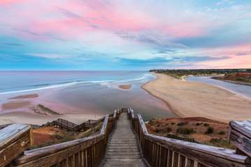 The wooden staircase leading down to the mouth of the Onkapringa river Port Noarlunga - Powered by Adobe