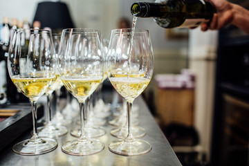 waiter brings glasses of champagne