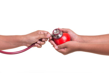 Fototapeta premium Checking heart and health care concept : Woman holding Stethoscope and check on red heart isolated on white