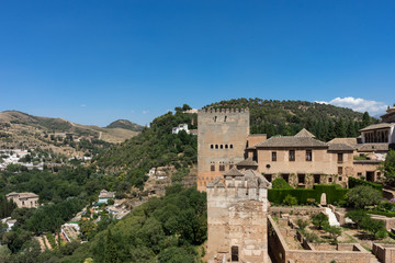Fototapeta premium View of the Nasrid Palaces (Palacios Nazaries) in Alhambra, Granada on a beautiful summer day, Spain, Europe