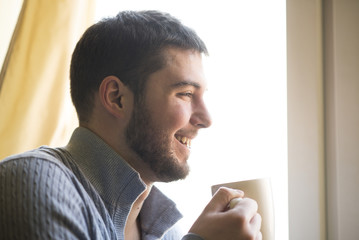 Enjoying sweet smell of his favorite hot drink