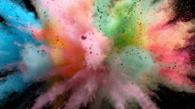 
Colorful powder/particles fly after being exploded against black background. Shot with high speed camera, phantom flex 4K. Slow Motion.
