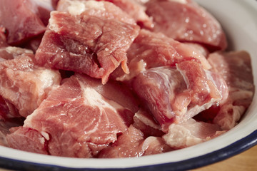Pieces of raw pork in a bowl