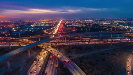 Urban aerial timelapse at night with interstate traffic indicative of city lifestyle. - Powered by Adobe