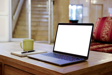 Workspace mockup laptop on wood table at home.