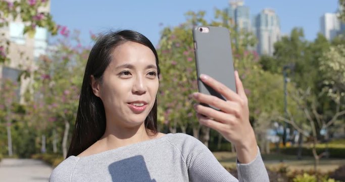 Woman having video call on cellphone