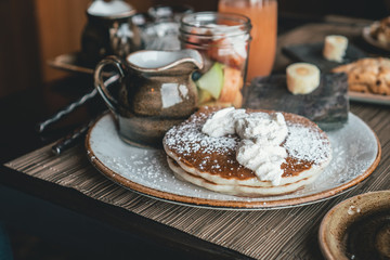 a country breakfast with a plate of pancakes