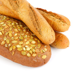 Baguette and bread with pumpkin seeds. Isolated on white background .