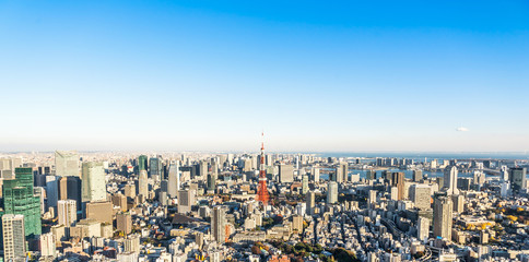 Asia Business concept for real estate and corporate construction - panoramic modern city skyline bird eye aerial view of tokyo tower and odaiba under blue sky in Roppongi Hill, Tokyo, Japan