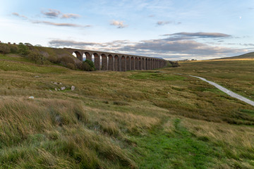Fototapeta na wymiar The Ribblehead Viaduct on the Settle-Carlisle Railway, near Ingleton in the Yorkshire Dales, North Yorkshire, UK