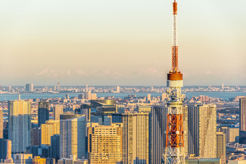 Fototapeta na wymiar Asia Business concept for real estate and corporate construction - panoramic modern city skyline bird eye aerial view of tokyo tower and odaiba under golden sun in Roppongi Hill, Tokyo, Japan
