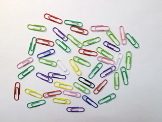 office paper clips of different colors on the desk