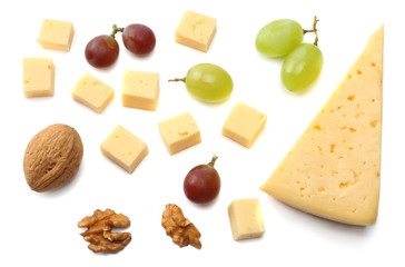 piece of cheese with grapes isolated on white background