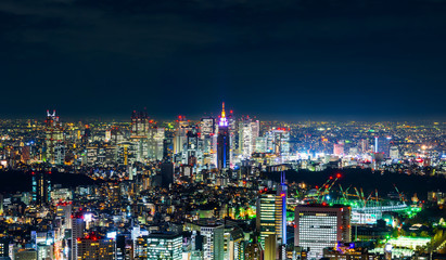 Fototapeta na wymiar Asia Business concept for real estate & corporate construction - panoramic modern city skyline view of Shinjuku district with neon night in Roppongi Hill, Tokyo, Japan