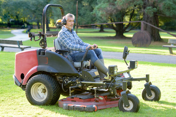 Man driving professional mower