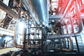 Equipment, cables and piping as found inside of a modern industrial power plant